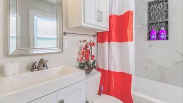 Bathtub, hair dryer, towels