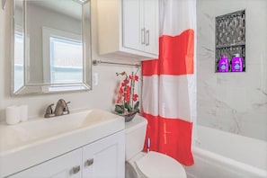 Bathtub, hair dryer, towels
