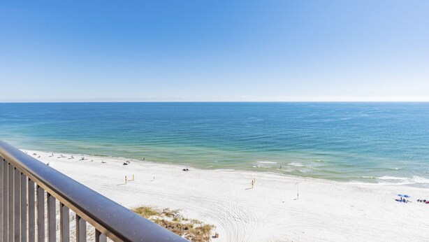 A beach with a clear sky, sandy shore, and ocean view. - PHOENIX V..GULF FRONT..10' CEILINGS..WKLY DISCOUNTS..RESERVED COVERED PARKING. (Orange Beach)