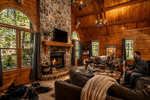 Updated log cabin, with 8 bedrooms, spacious living spaces, and upgraded & comfortable features.