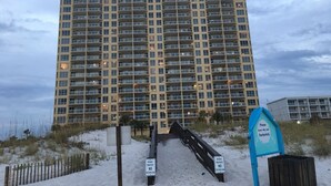 A high-rise building with multiple balconies and a private property sign. - 𝔾𝕦𝕝𝕗𝔽𝕣𝕠𝕟𝕥 𝑬𝒎𝒆𝒓𝒂𝒍𝒅 𝑰𝒔𝒍𝒆 9th Floor Stocked & Stellar Reviews! (Unknown)
