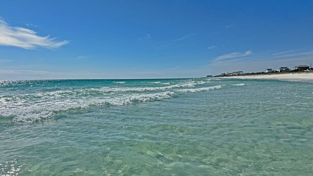 A beach with clear turquoise water and a sandy shore. - Exquisite 1st-Floor Panama City Beachfront, Low Density, Step from Deck to Sand  (Panama City Beach)