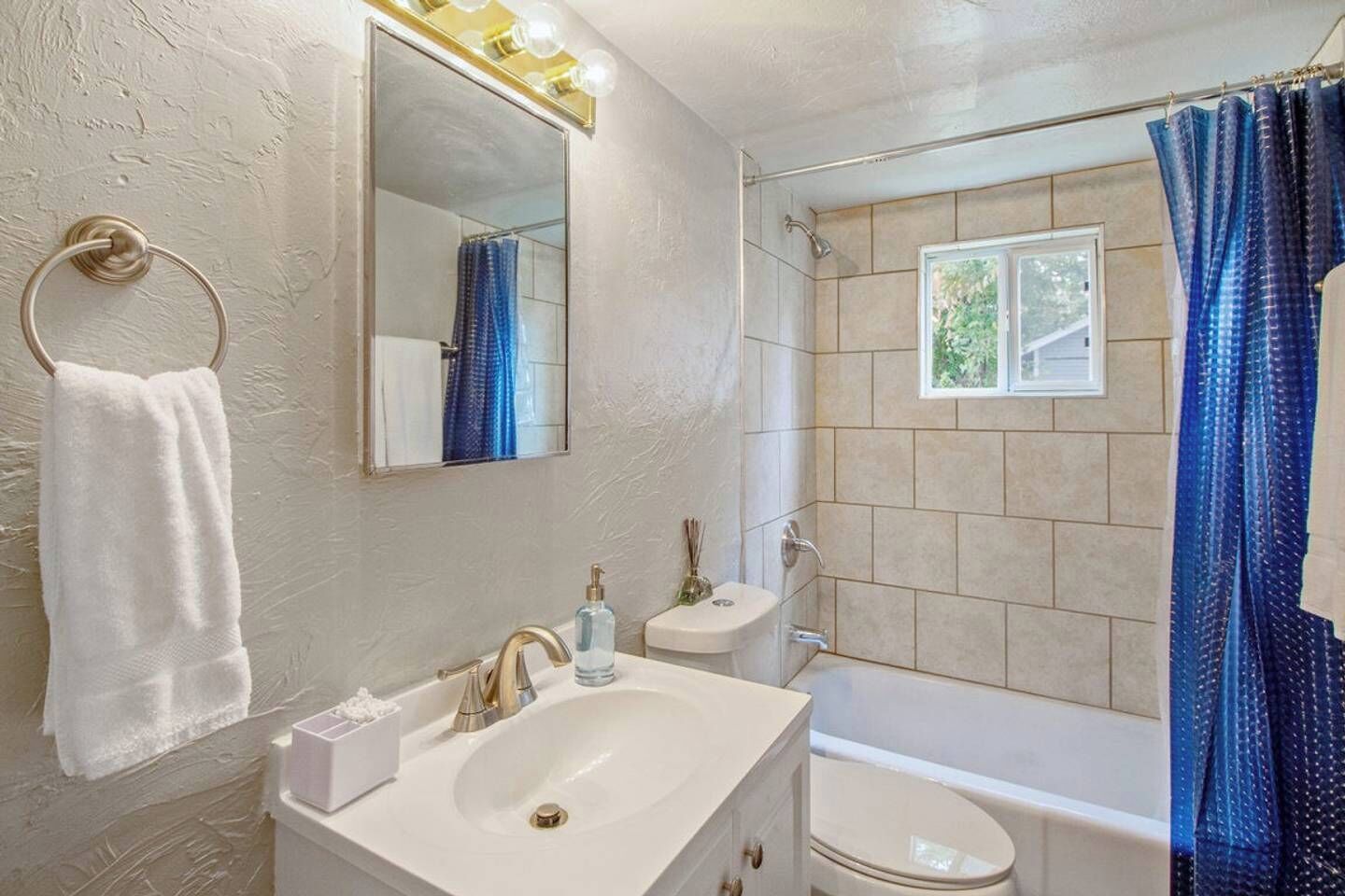 Bathtub, hair dryer, towels
