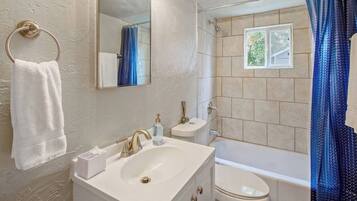 Bathtub, hair dryer, towels