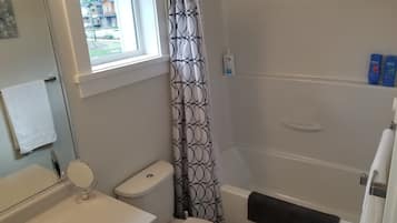 Combined shower/tub, hair dryer, towels, soap