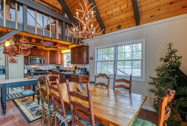 Enjoy meals in this well-appointed dining area with a large wooden table and six comfortable chairs.