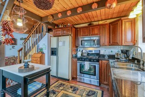 Enjoy cooking in this well-equipped kitchen with stainless steel appliances and ample storage.
