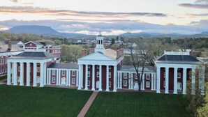 A large, historic building with symmetrical architecture, featuring a central pavilion and multiple wings. - Modern Farmhouse near VMI, W&L, SVU & VA Horse Ctr (Lexington)