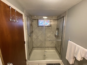 Shower, towels, soap, toilet paper