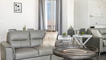 Superior Apartment, 1 King Bed | Living area | 32-inch flat-screen TV with digital channels, TV