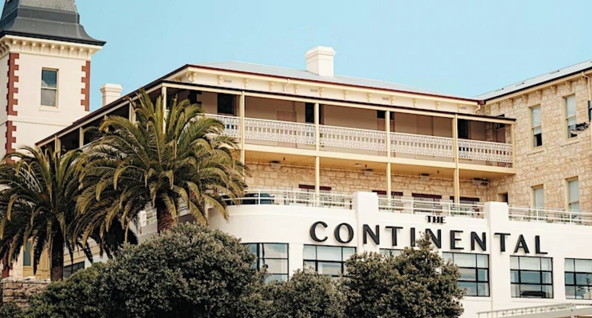 A building with a balcony and the name 'Continental' visible on the facade.