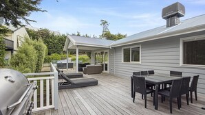A deck with a grill, outdoor seating, and a covered patio area. - Lady Nelson, Sorrento - hot tub. (SORRENTO)