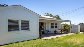 A single-story mobile home with a covered patio area.