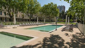 Seasonal outdoor pool, open 10:00 AM to 7:00 PM, pool loungers