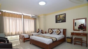 Family Room | Minibar, desk, soundproofing, rollaway beds - RedDoorz Plus @ Pham Ngu Lao 2 (Ho Chi Minh City)