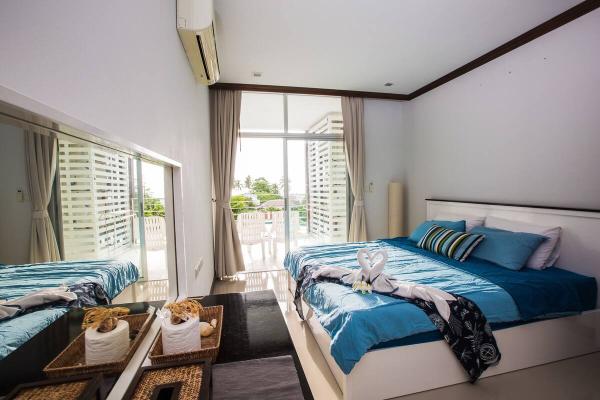 2-Bedroom Condo B-35 | Living room | Flat-screen TV