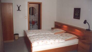 Desk, blackout curtains, bed sheets