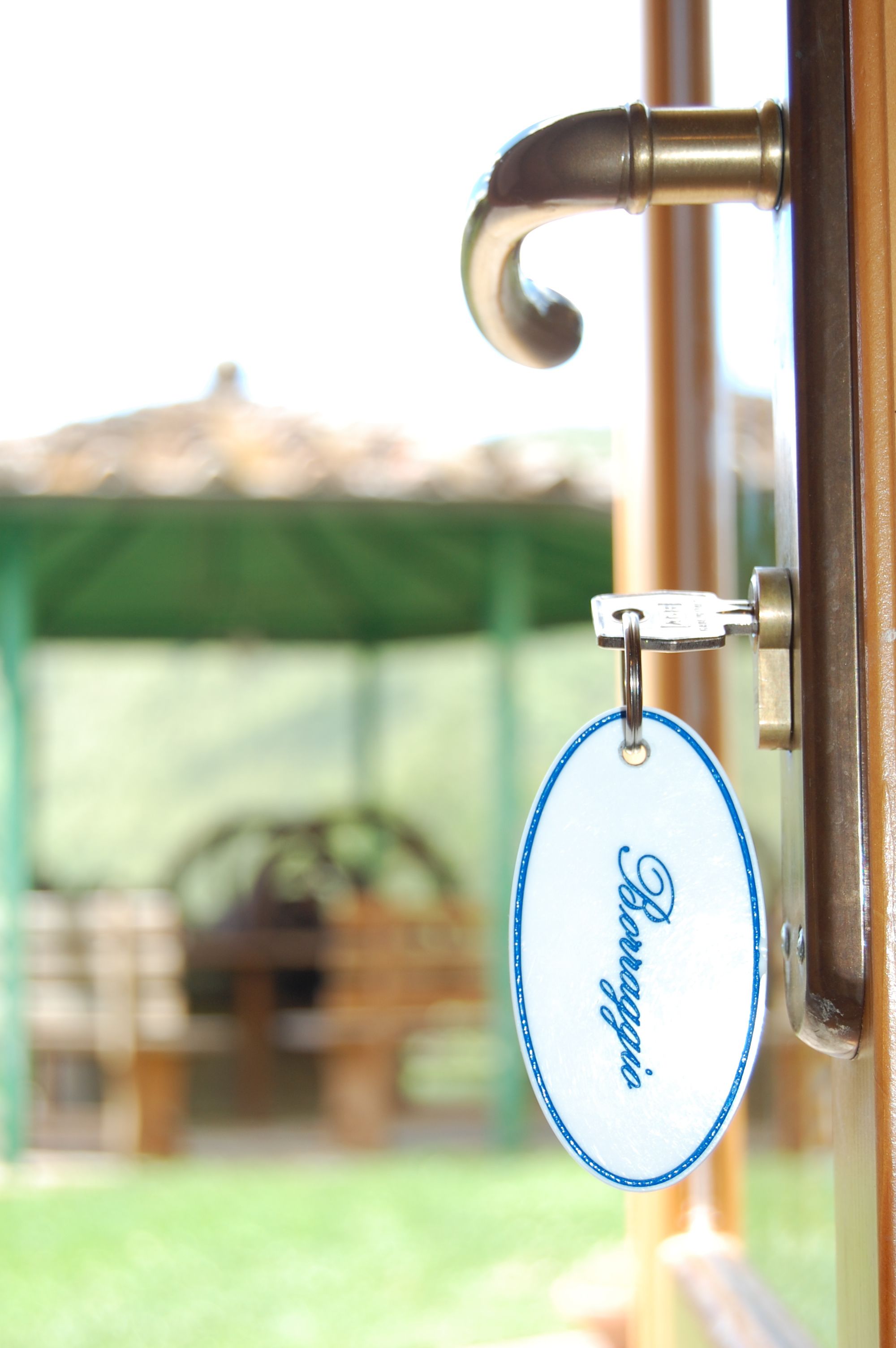 A door handle with a keychain tag.