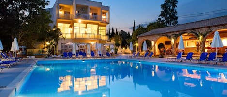 Seasonal outdoor pool, open 10:00 AM to 6:00 PM, pool umbrellas