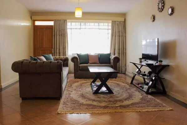 Flat-screen TV - The Serene Apartment (Nairobi)