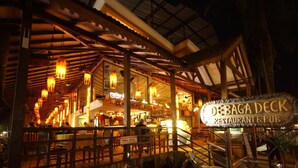 Debaga Deck Restaurant & Pub with outdoor seating and a covered area. - De Baga Deck Comforts (Calangute)
