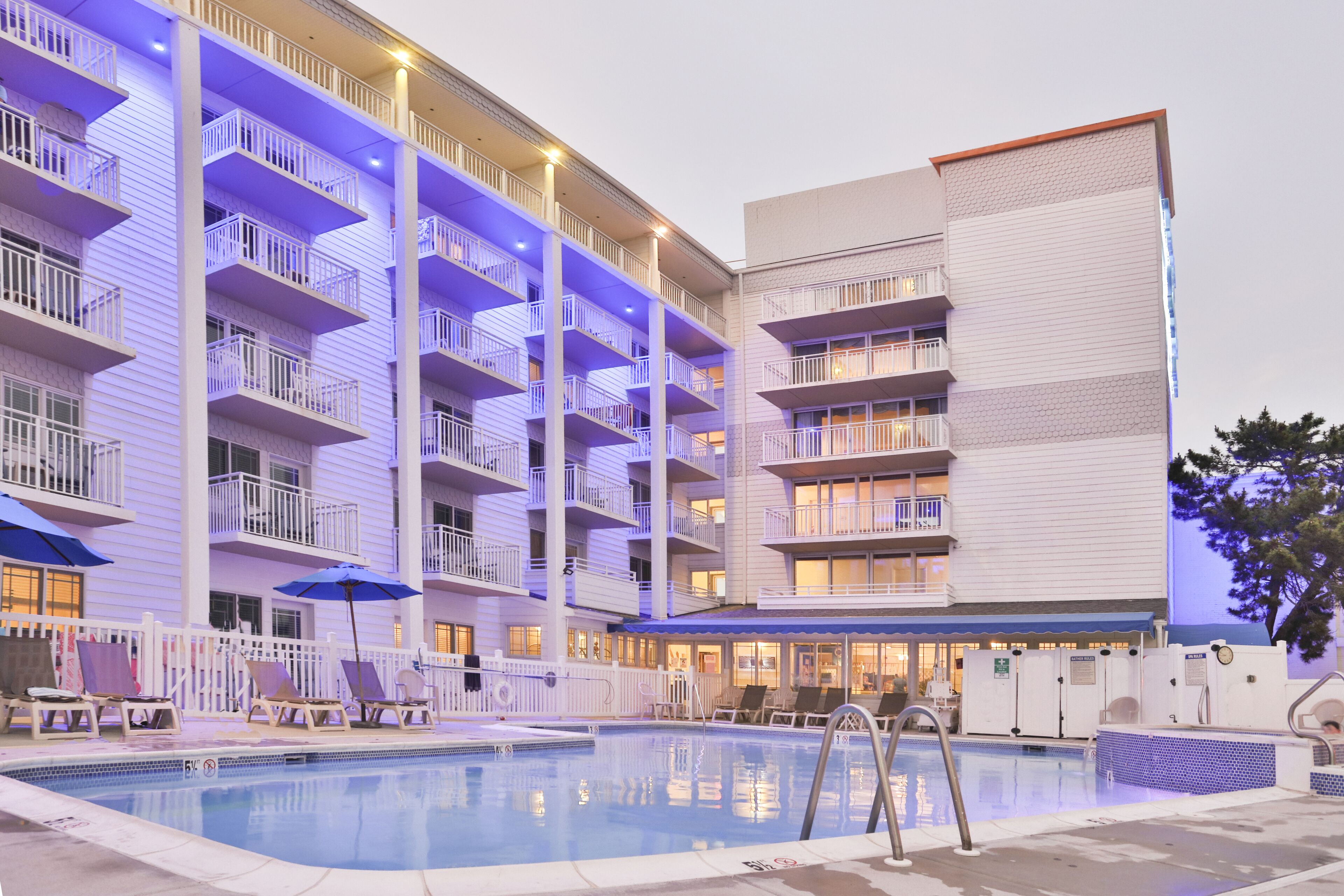 seasonal outdoor pool, pool umbrellas, pool loungers