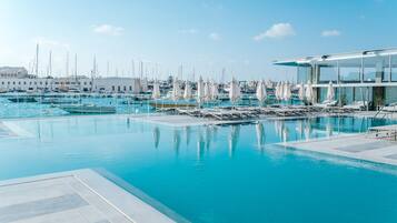 Outdoor pool, open 10:00 AM to 6:00 PM, pool umbrellas, sun loungers