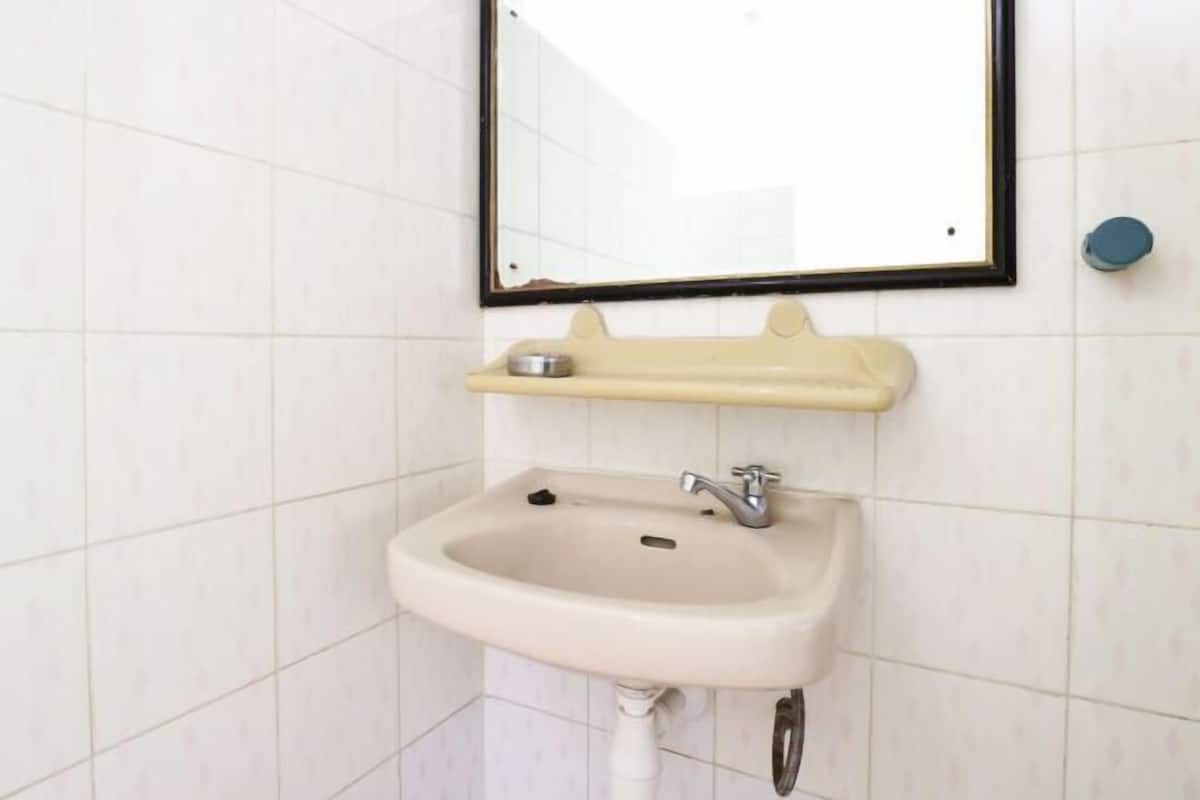 Baño | Regadera y toallas