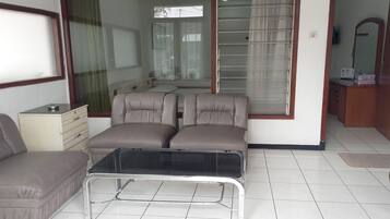 Family Triple Room | Living area | TV