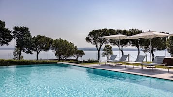 Outdoor pool, pool umbrellas, sun loungers