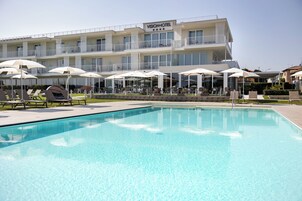 Outdoor pool, pool umbrellas, sun loungers