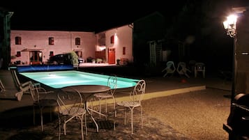Seasonal outdoor pool, open 10:00 AM to 9:00 PM, pool umbrellas