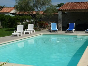 Seasonal outdoor pool, open 11 AM to 8 PM, pool umbrellas, pool loungers
