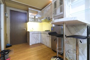 2 Bedrooms | Private kitchen | Fridge, stovetop - The Suites Metro Apartment - King Property (Bandung)