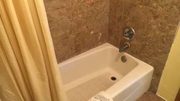 Economy Single Room, 1 King Bed | Bathroom | Bathtub, free toiletries, towels