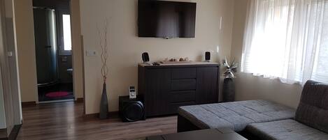 Apartment, 4 Bedrooms | Living room | Flat-screen TV