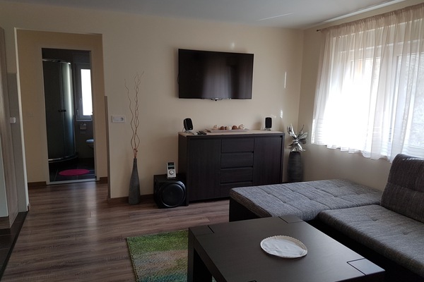 Apartment, 4 Bedrooms | Living room | Flat-screen TV