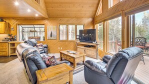 A wooden interior with a sofa, coffee table, and TV. - 2 Mi to Rocky Mountain Nat'l Park: Cabin w/ Views (Grand Lake)
