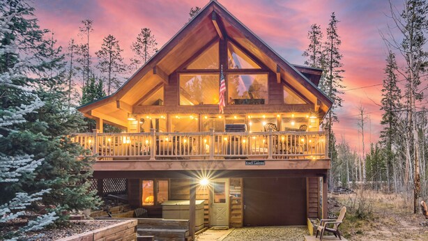 A two-story log cabin with a balcony, large windows, and a deck area. - 2 Mi to Rocky Mountain Nat'l Park: Cabin w/ Views (Grand Lake)