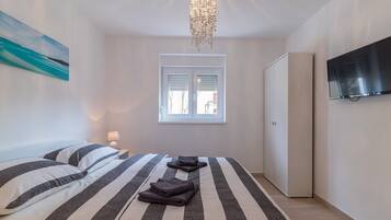 2 habitaciones, tabla de planchar con plancha, wifi y ropa de cama