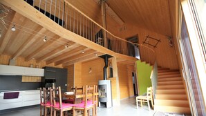A wooden interior with a dining area, kitchen, and staircase. - Riesling cottage for 2 to 8 people, ideal for families,  (Rouffach)