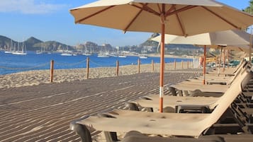 On the beach, sun loungers, beach towels