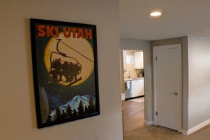 Stylish hallway leads to a well-equipped kitchen with modern appliances.