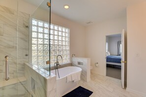 Bathtub, hair dryer, towels, soap