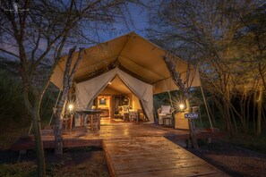 A tented accommodation with a wooden deck, a dining area, and a sign reading "KAZURI". - Mara Major Camp (Maasai Mara)