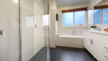Bathtub, hair dryer, towels, soap