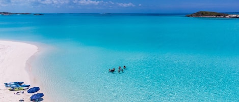 On the beach, sun-loungers, beach towels