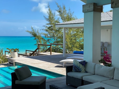 Outdoor pool, an infinity pool. Luxurious 5000 sq ft Beachfront Villa ON TROPIC OF CANCER BEACH