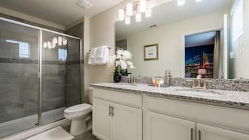 Combined shower/tub, hair dryer, towels, soap