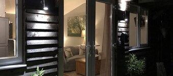 Lovely Wooden Lodge, views over an orchard, outside seating.